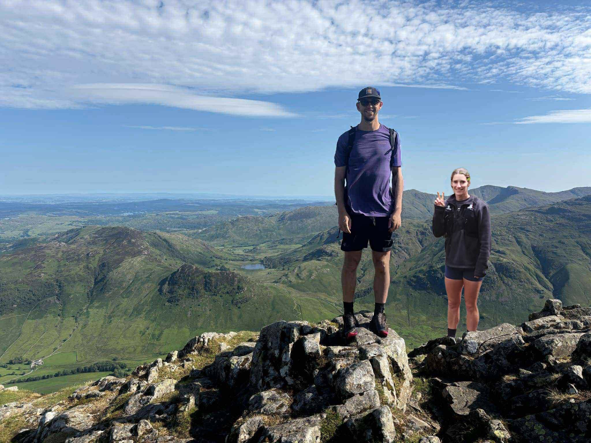Rob and Cat standing on top of a mountain